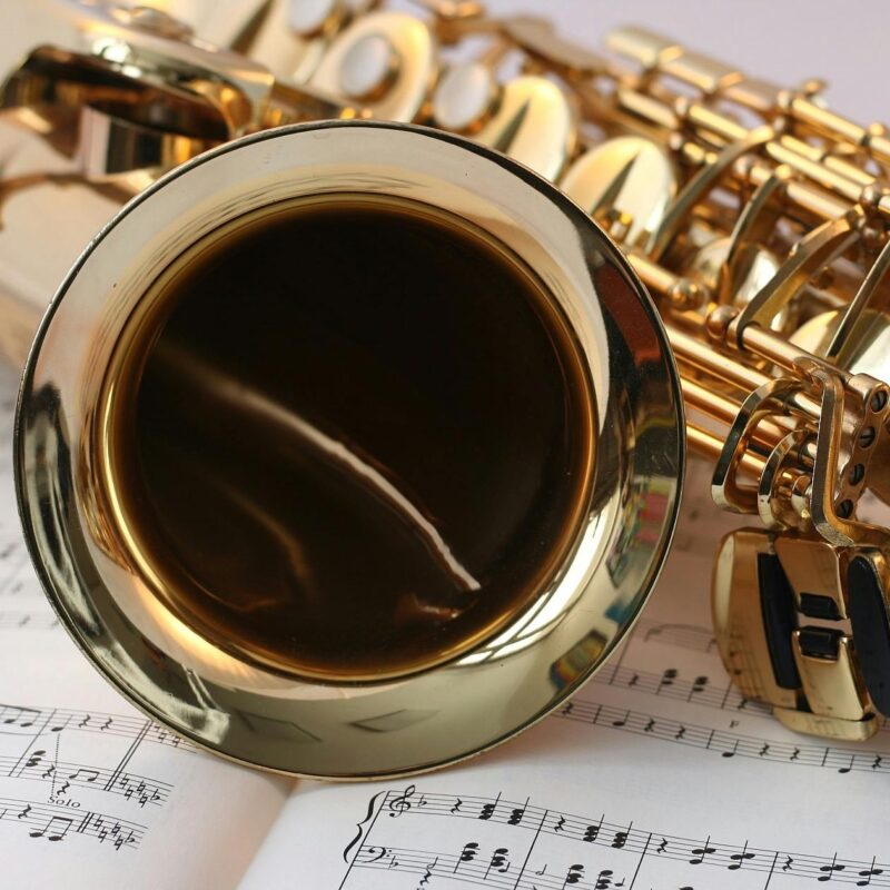 saxophone laying on sheet music
