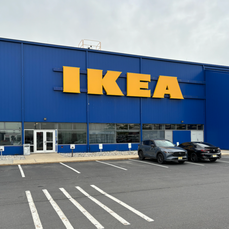 Outside IKEA Elizabeth entrance with two cards parked by the entrance