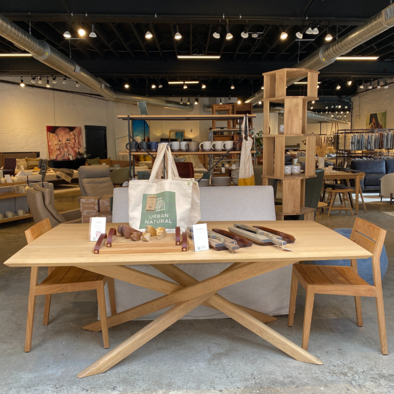 Table with tote bags and cutting boards in the Urban Natural showroom